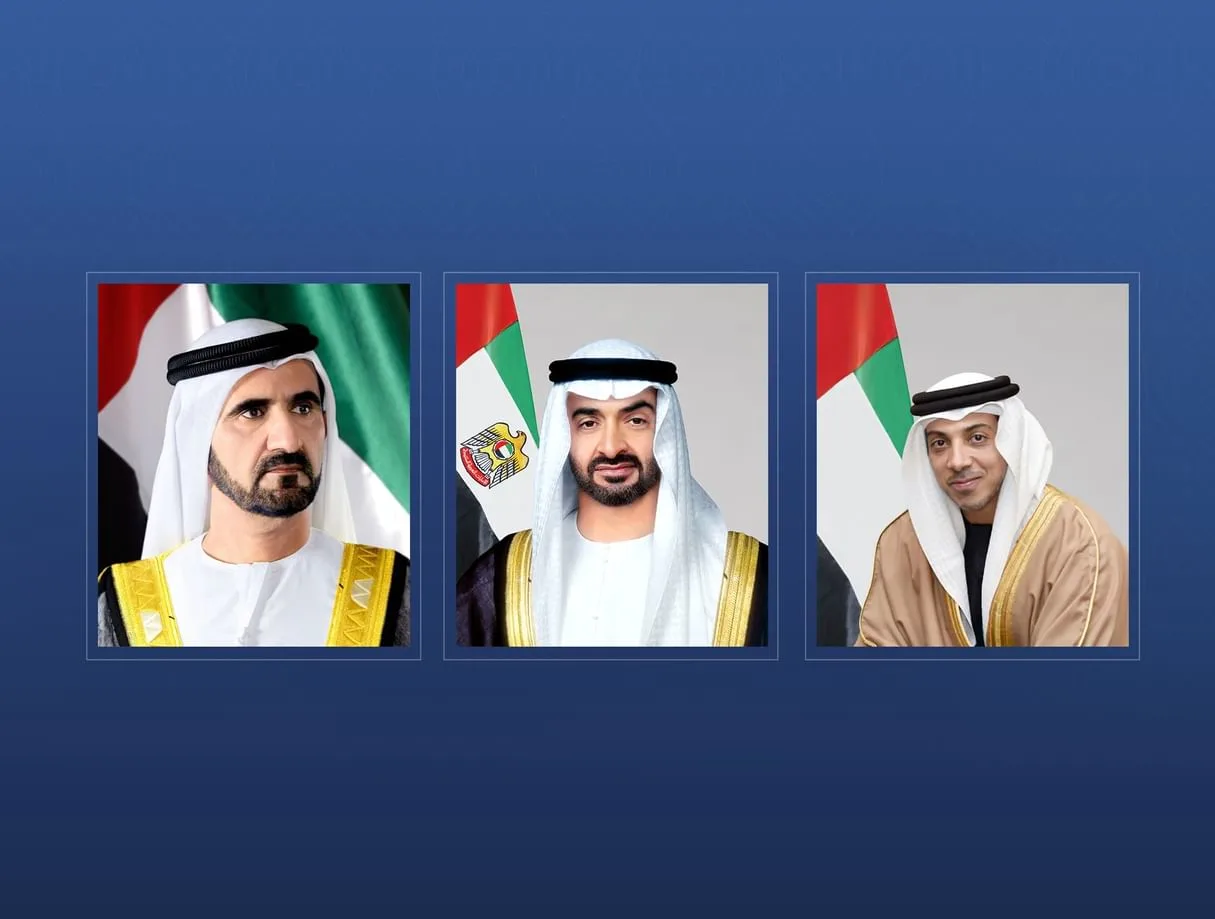 Official portraits of Sheikh Mohammed bin Rashid Al Maktoum, Sheikh Mohamed bin Zayed Al Nahyan, and Sheikh Mansour bin Zayed Al Nahyan, with the UAE flag in the background.