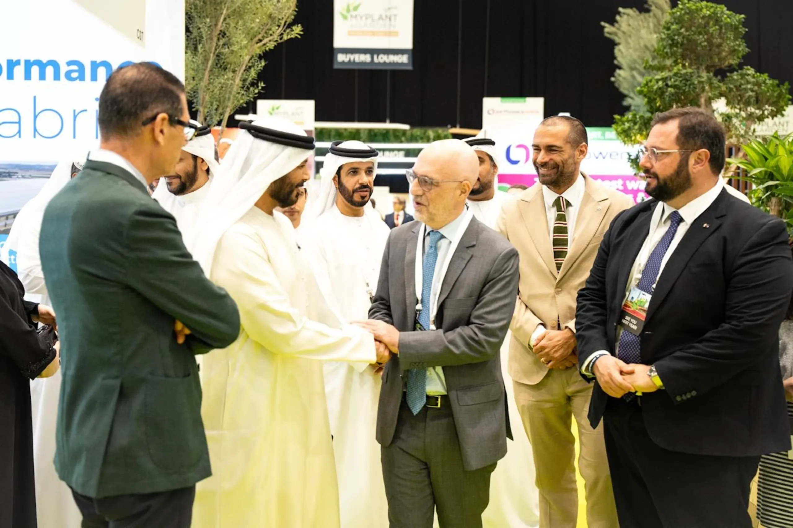 UAE officials H.E. Dr Mohammed Salman Alhammadi and H.E. Marwan Ahmed Bin Ghalita inaugurate the Myplant & Garden exhibition in Dubai, shaking hands with an executive while other attendees look on.