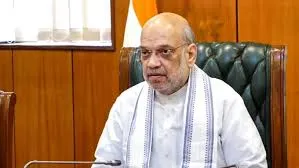 Union Home Minister Amit Shah chairs the 32nd Northern Zonal Council meeting in Faridabad, Haryana, on November 17, 2025. He is seated at a table, wearing a white kurta with a white and blue striped shawl, looking forward.