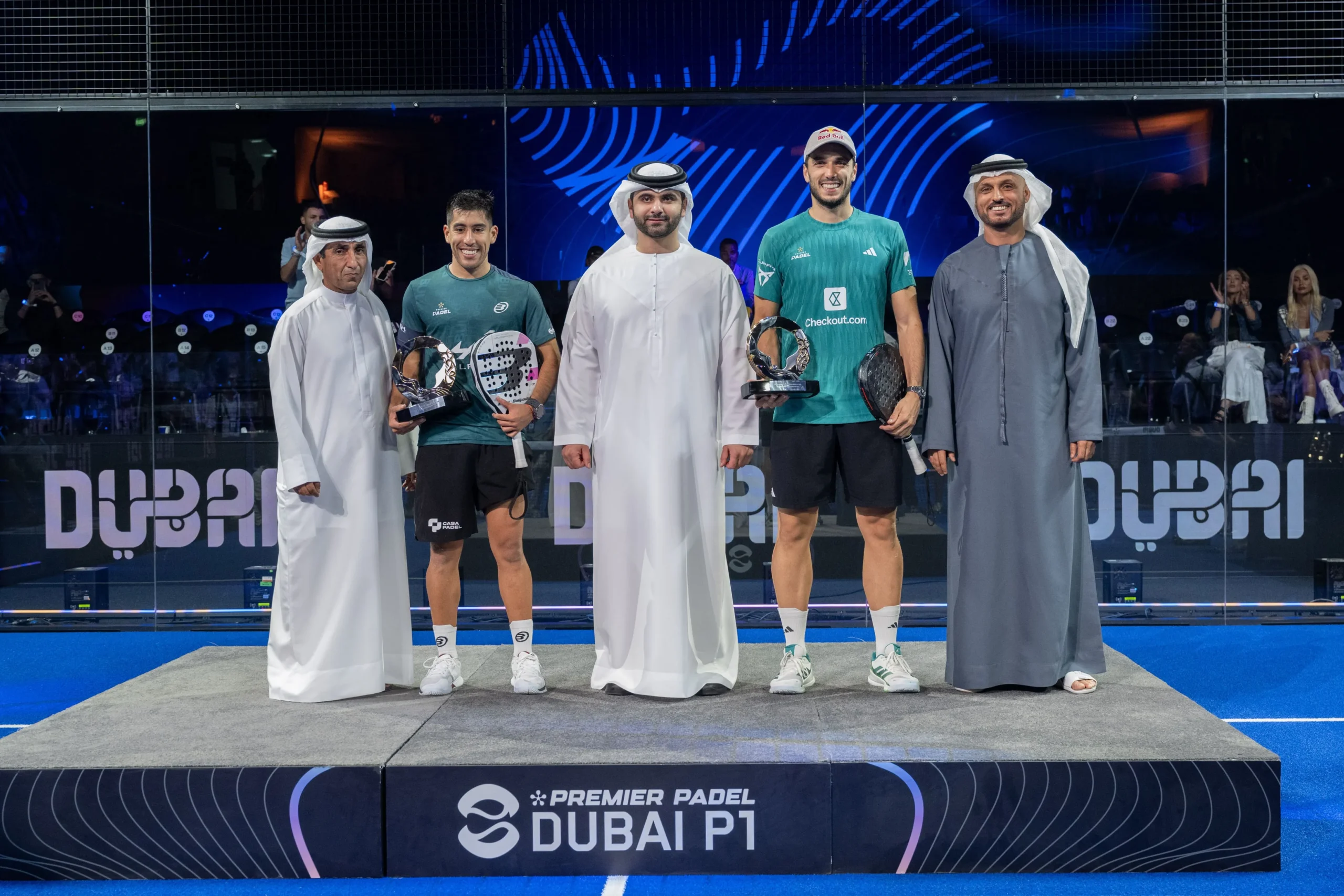 Sheikh Mansoor bin Mohammed bin Rashid Al Maktoum and Sheikh Saeed bin Maktoum Juma Al Maktoum presenting trophies to padel players Agustín Tapia and Arturo Coello at the Dubai Premier Padel P1.