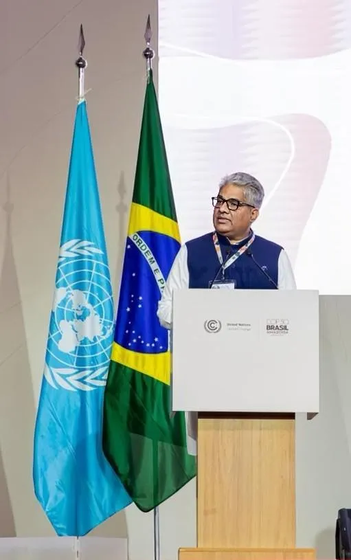 India's Union Environment Minister Bhupender Yadav speaks at a podium with the UN and Brazil flags behind him, delivering India's National Statement at UNFCCC CoP30 in Belém, Brazil.