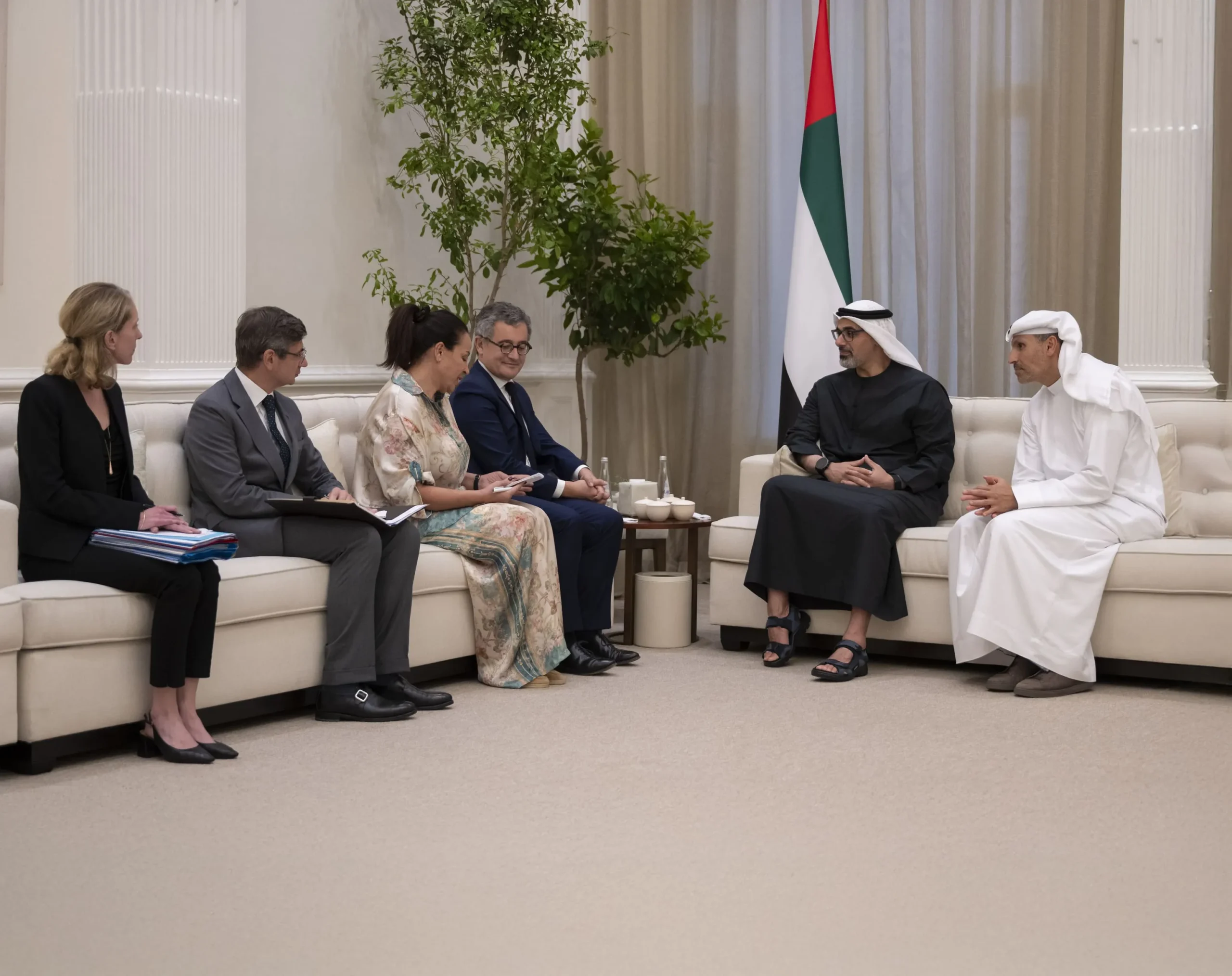 Sheikh Khaled bin Mohamed bin Zayed Al Nahyan and Gérald Darmanin, French Minister of Justice, meet with delegations in a formal setting in Abu Dhabi.