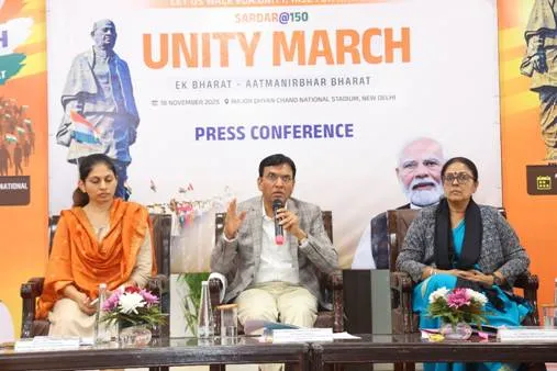 Union Minister Dr. Mansukh Mandaviya addressing a press conference about the Sardar@150 Unity March in New Delhi, seated between MoS Raksha Khadse and Secretary Dr. Pallavi Jain Govil.