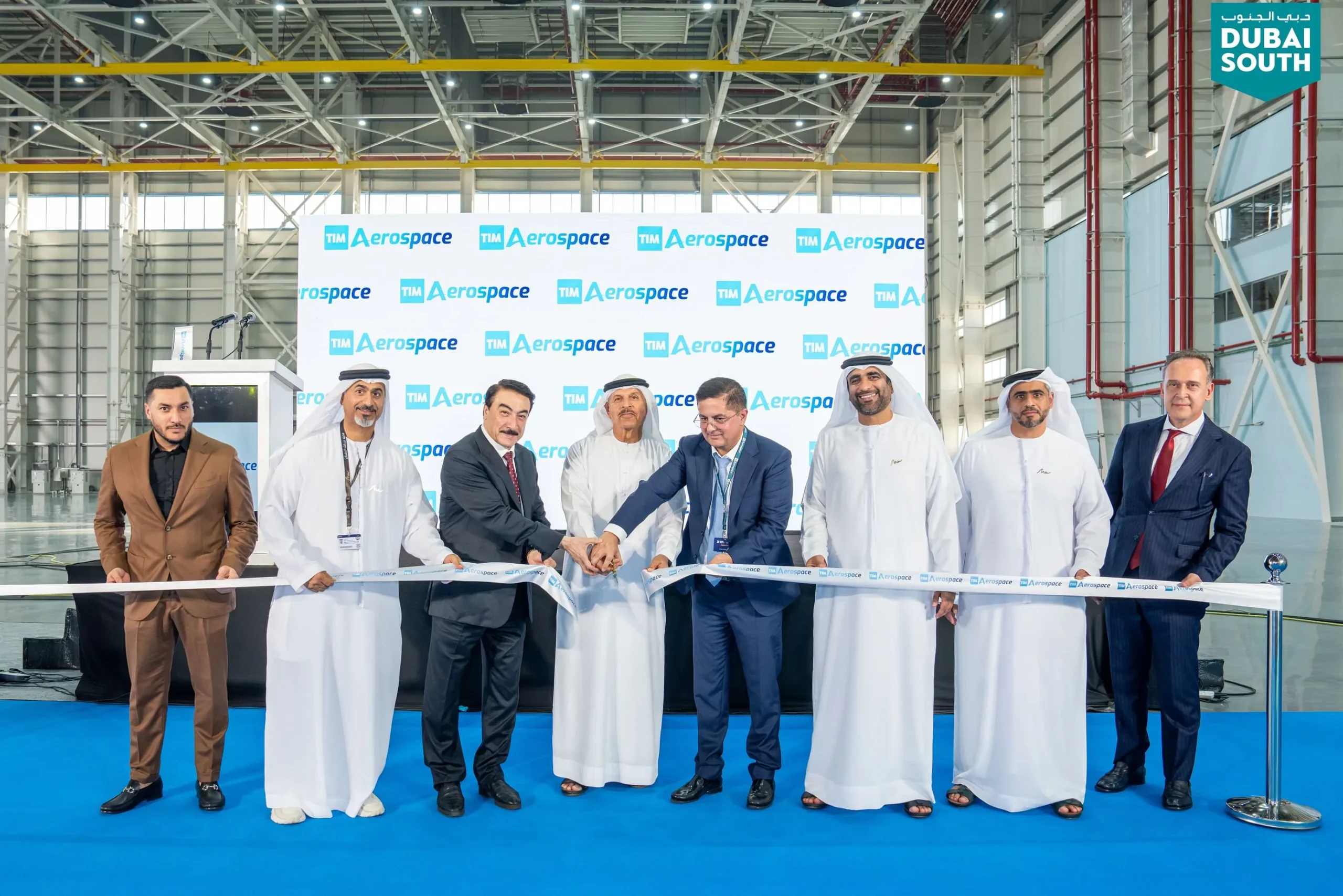 Executives from Dubai South and TIM Aerospace cutting a ribbon to inaugurate the new MRO hangar at Mohammed bin Rashid Aerospace Hub.