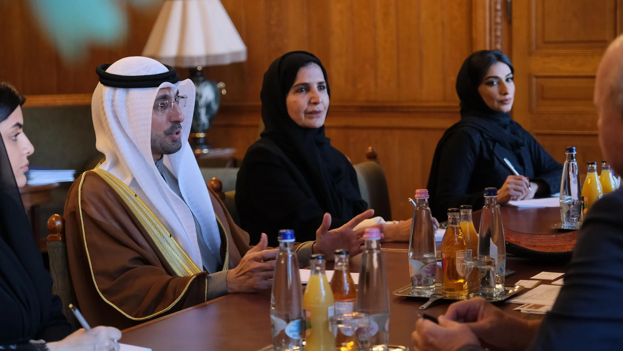 Dr. Omar Abdulrahman Al Nuaimi in traditional Emirati attire and Afra Rashid Al Basti attend a meeting at the Hungarian National Assembly in Budapest.