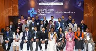 Group of delegates and senior officials posing on stage in front of a banner reading Regional Open Digital Health Summit during the event in New Delhi.