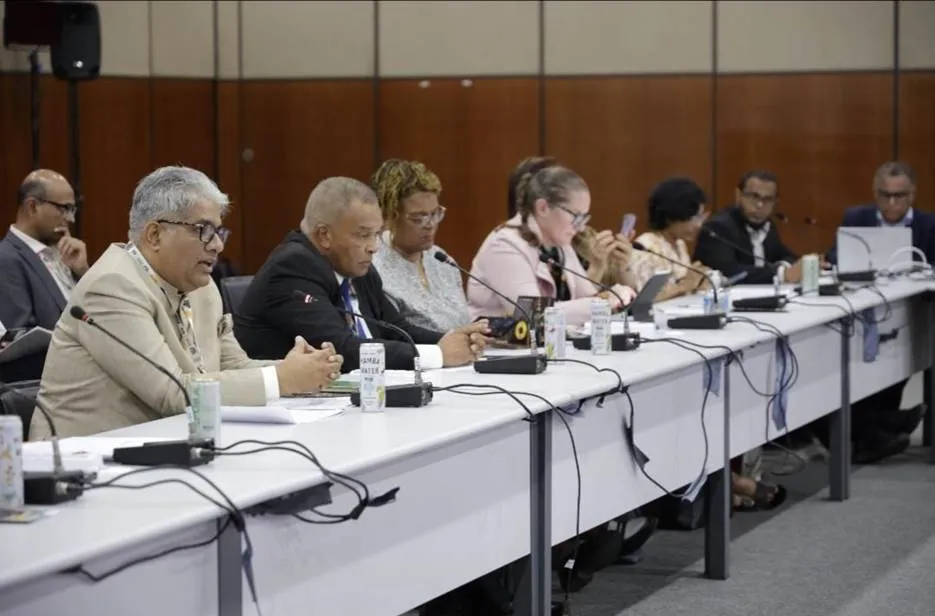 Union Environment Minister Bhupender Yadav addresses the High-Level Ministerial Leadership Session of the ISA SIDS Platform at COP30 in Belém, Brazil, seated at a conference table with international delegates.