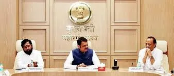 Eknath Shinde, Devendra Fadnavis, and Ajit Pawar seated together at a desk with the Maharashtra state emblem in the background.