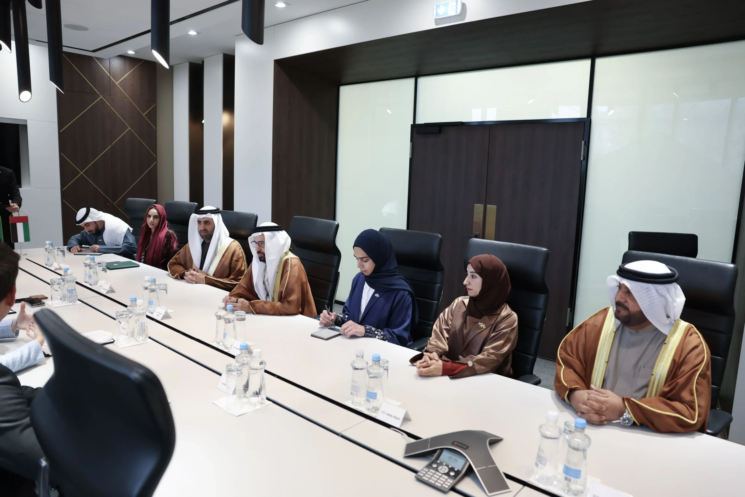 Members of the UAE Federal National Council delegation seated at a long conference table during a diplomatic meeting at the Ministry of Foreign Affairs and Trade in Budapest.