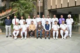 Group photograph of Expenditure Secretary Shri V. Vualnam seated with senior officials and uniformed officers at the AJNIFM campus.