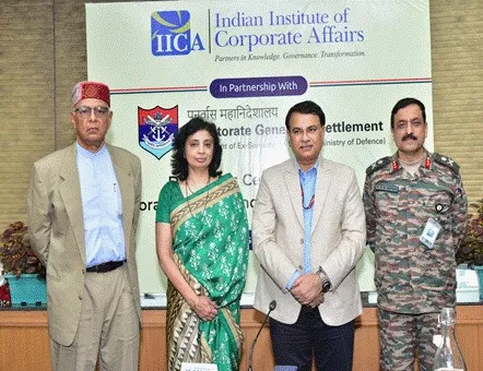 Dignitaries including Dr. K P Krishnan, Smt. Sukriti Likhi, and Shri Gyaneshwar Kumar Singh standing with a senior military officer in front of an IICA and DGR banner during the valedictory ceremony.
