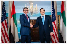 UAE Foreign Minister Sheikh Abdullah bin Zayed Al Nahyan shakes hands with US Secretary of State Marco Rubio in front of American and Emirati flags.