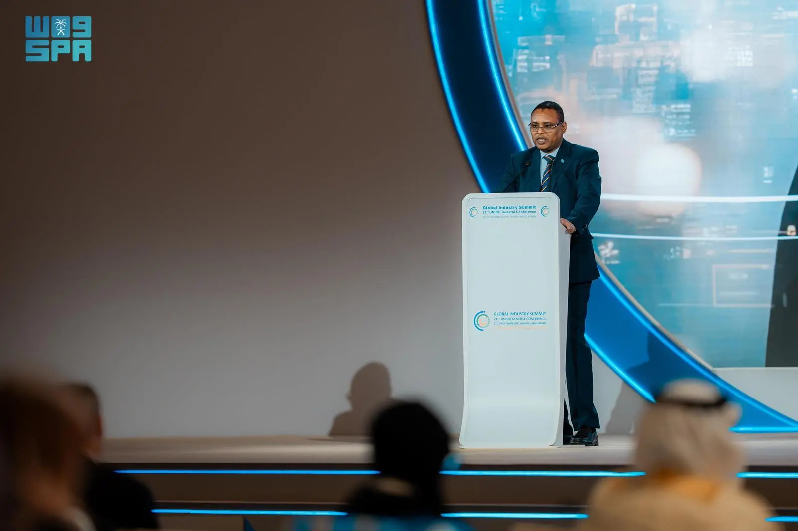 Somalia’s Second Deputy Prime Minister Jibril Abdirashid Haji Abdi stands at a podium delivering a speech during the 21st UNIDO General Conference in Riyadh, Saudi Arabia.