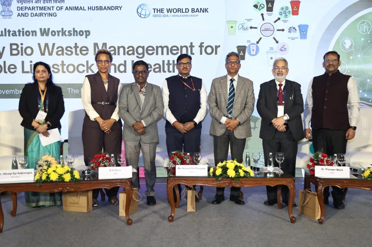 Seven officials including Secretary Shri Naresh Pal Gangwar standing on stage during the National Consultation Workshop on Veterinary Bio Waste Management in New Delhi.