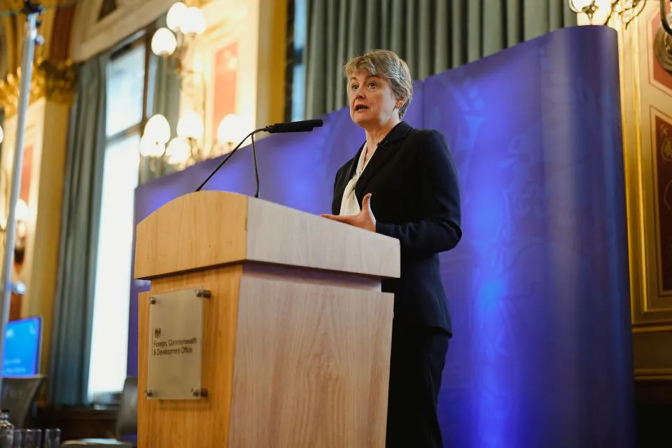 UK Foreign Secretary Yvette Cooper speaks at a podium bearing the Foreign, Commonwealth & Development Office logo during an event marking the 25th anniversary of UN Security Council Resolution 1325 on Women, Peace and Security.