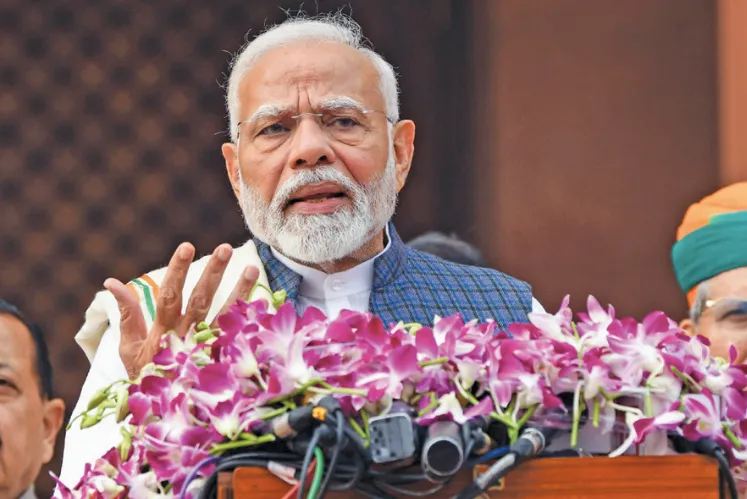 Prime Minister Narendra Modi speaking at a podium adorned with purple orchids during the Constitution Day celebrations on 26 November 2025.