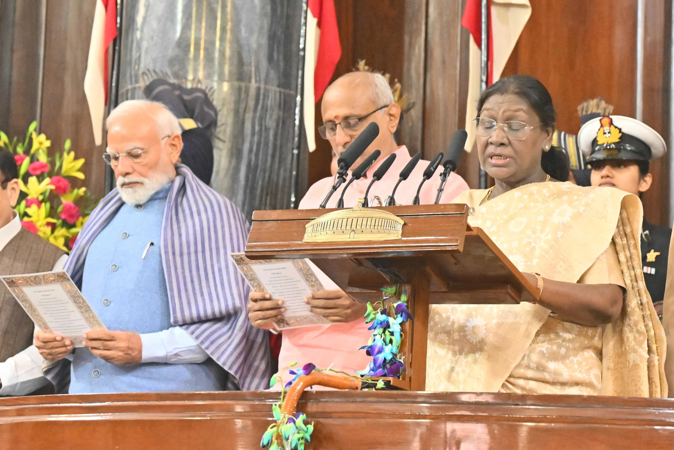President Droupadi Murmu leads the reading of the Preamble to the Constitution alongside Prime Minister Narendra Modi and Lok Sabha Speaker Om Birla during the Samvidhan Divas celebration in the Central Hall of Samvidhan Sadan, New Delhi.