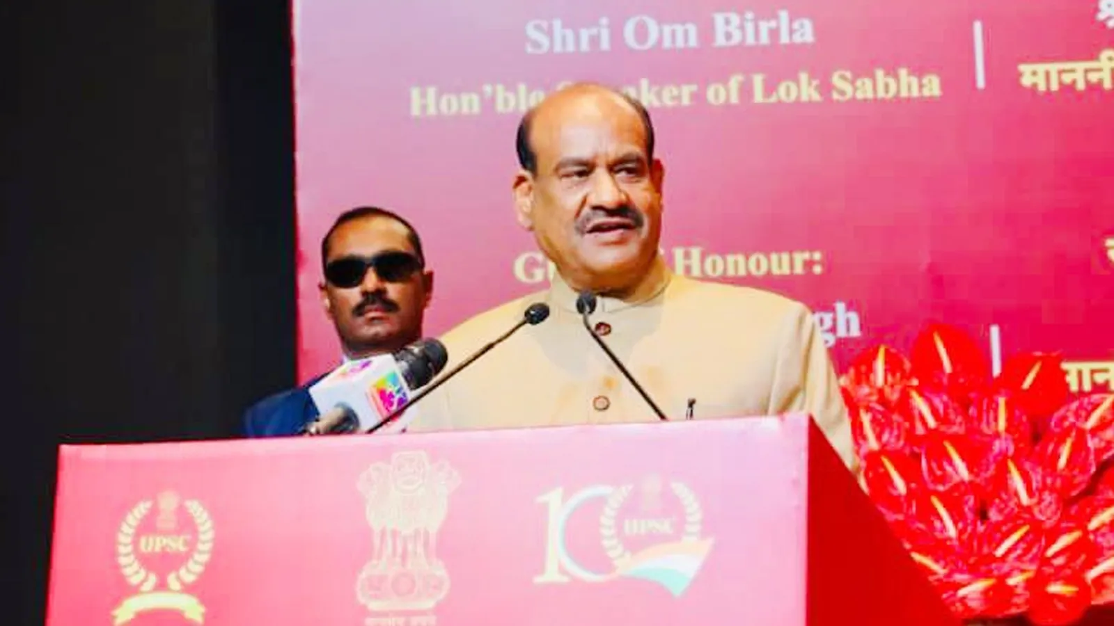 Lok Sabha Speaker Shri Om Birla addressing the inaugural session of UPSC Shatabdi Sammelan (Centenary Celebrations) in New Delhi, standing at a podium with UPSC 100-year logo.