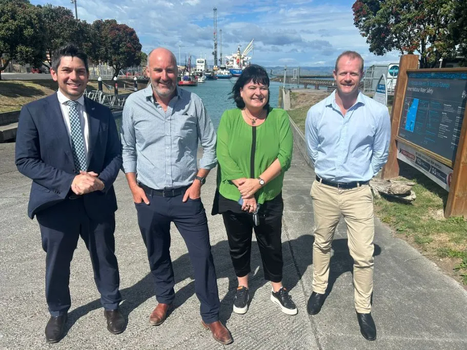 Associate Transport Minister James Meager (left), alongside local National MP Dana Kirkpatrick and two Eastland Port representatives, stand at Eastland Port in Gisborne after announcing $5 million in Government funding for new container-handling equipment.